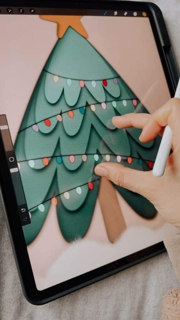 e2849a436484ca5e1d7f08481103fccf Digital drawing of a Christmas tree on a tablet with a stylus, featuring colorful lights and a star on top, being edited by a hand. | Sky Rye Design Digital drawing of a Christmas tree on a tablet with a stylus, featuring colorful lights and a star on top, being edited by a hand.