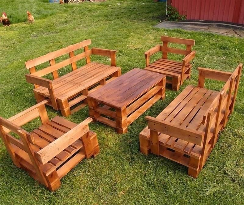 c42bfadeb70fc0391b670bb037f2af09 Outdoor wooden pallet furniture set on grass, including chairs, benches, and a table, ideal for garden lounging and sustainable living. | Sky Rye Design Outdoor wooden pallet furniture set on grass, including chairs, benches, and a table, ideal for garden lounging and sustainable living.