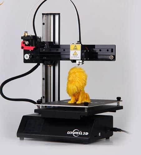 A 3D printer creating a detailed yellow lion figurine on a black platform, demonstrating precision and advanced printing technology.