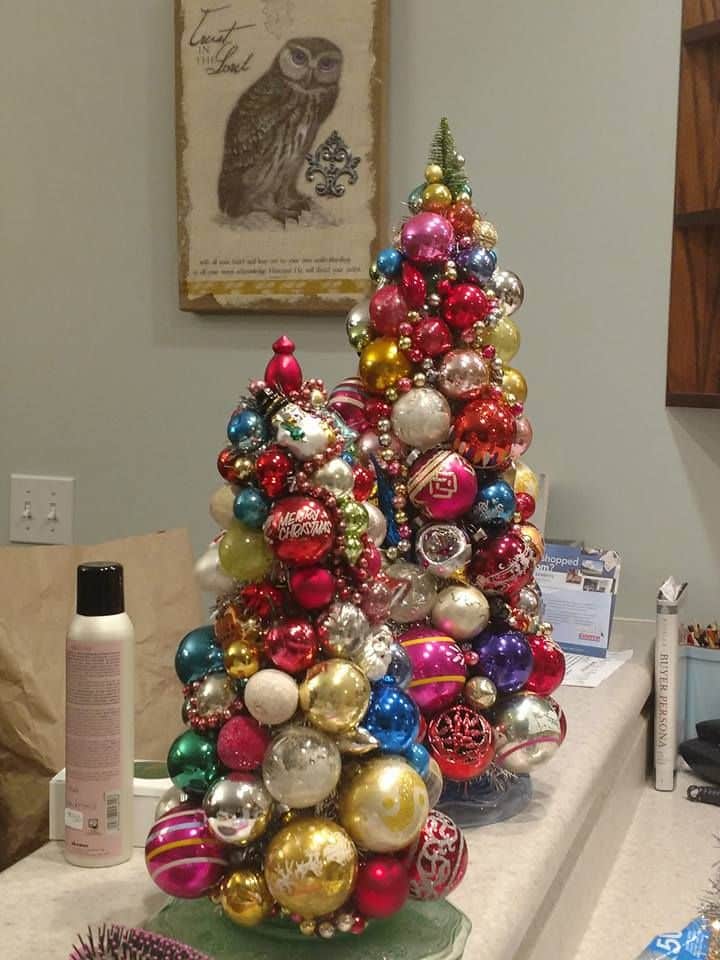 ce48fd665470c82d57d0978cc043bdad Festive Christmas ornament trees with colorful baubles on a countertop, adding holiday cheer to indoor decor. | Sky Rye Design Festive Christmas ornament trees with colorful baubles on a countertop, adding holiday cheer to indoor decor.