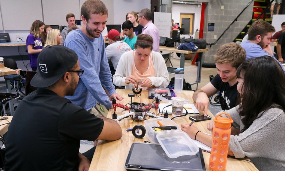 drone-class-1000x600 Students collaborate on drone project in a technology lab, engaged and focused on teamwork and innovation with tools and resources. | Sky Rye Design best schools for industrial design