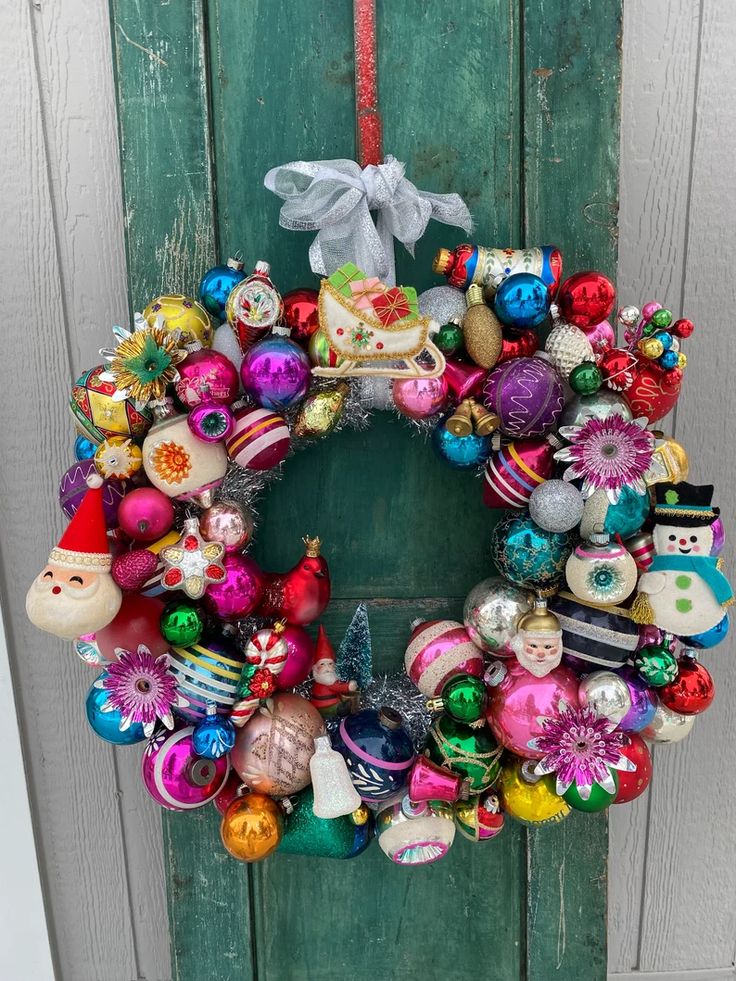 e584c1f597fc8b477c4b8eb103edadba Festive holiday wreath with colorful ornaments and decorations, perfect for Christmas door display. | Sky Rye Design Festive holiday wreath with colorful ornaments and decorations, perfect for Christmas door display.
