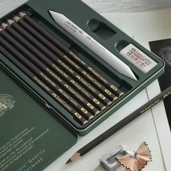 faber-castell-metal-case-8-matte-graphite-pencils-and-accessories Faber-Castell drawing pencil set with various grades, ideal for artists. Includes pencils, eraser, sharpener, and blending tool. | Sky Rye Design Faber-Castell drawing pencil set with various grades, ideal for artists. Includes pencils, eraser, sharpener, and blending tool.
