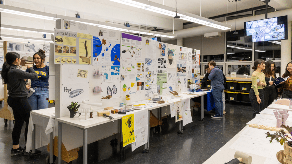 featuref23launchpad-78 Students engage in a design project showcase, displaying creative work and concepts on a classroom wall. | Sky Rye Design Students engage in a design project showcase, displaying creative work and concepts on a classroom wall.