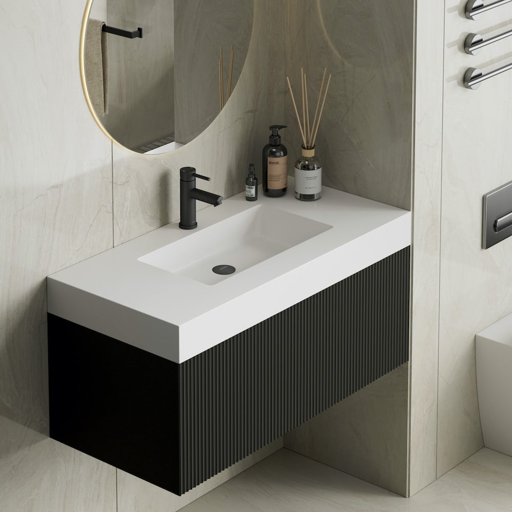 london-matt-black-bathroom-vanity-with-stone-sink-and-warranty_672526902_xl Modern bathroom sink with black faucet, white countertop, and decorative items. Beige tiles and circular mirror enhance the elegant design. | Sky Rye Design Modern bathroom sink with black faucet, white countertop, and decorative items. Beige tiles and circular mirror enhance the elegant design.