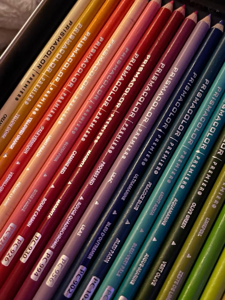 prismacolors Close-up of vibrant Prismacolor Premier colored pencils neatly arranged, showcasing a wide range of hues for artists and designers. | Sky Rye Design Close-up of vibrant Prismacolor Premier colored pencils neatly arranged, showcasing a wide range of hues for artists and designers.