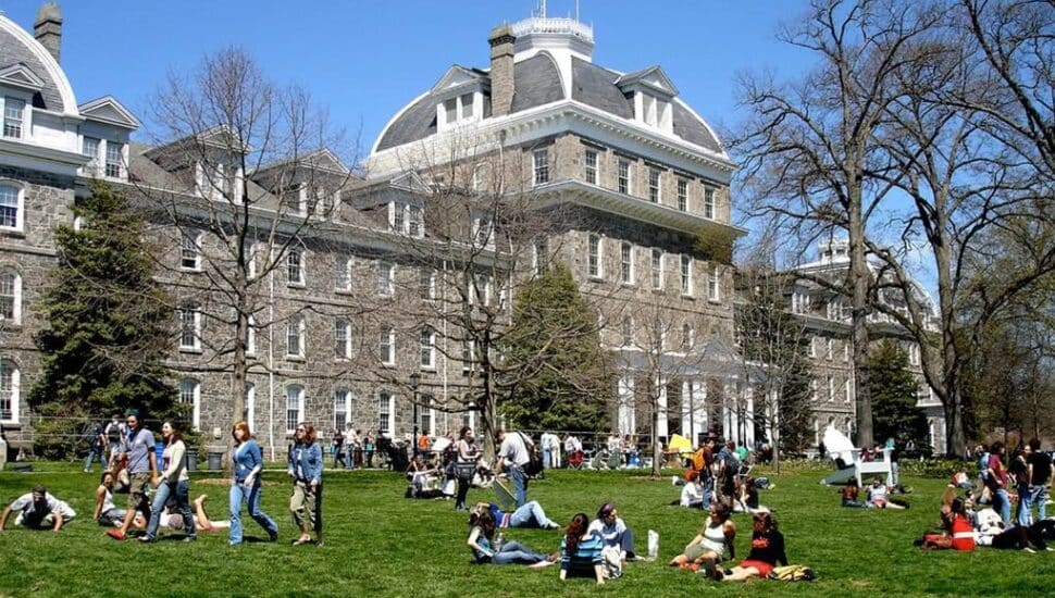 swarthmore-970x550 College students relaxing on a sunny campus lawn in front of a large stone building during springtime, enjoying outdoor activities. | Sky Rye Design College students relaxing on a sunny campus lawn in front of a large stone building during springtime, enjoying outdoor activities.