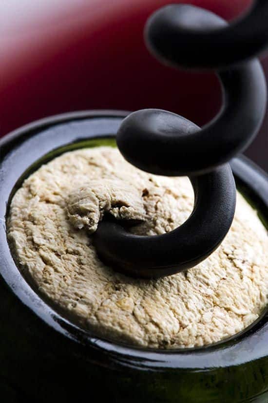 _ Close-up of a corkscrew piercing a cork in a wine bottle, ready for opening and serving. Perfect for wine lovers and enthusiasts. | Sky Rye Design Close-up of a corkscrew piercing a cork in a wine bottle, ready for opening and serving. Perfect for wine lovers and enthusiasts.