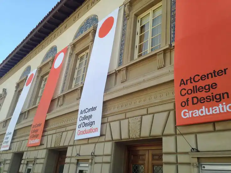 Banners for ArtCenter College of Design Graduation hanging on a classic building facade.