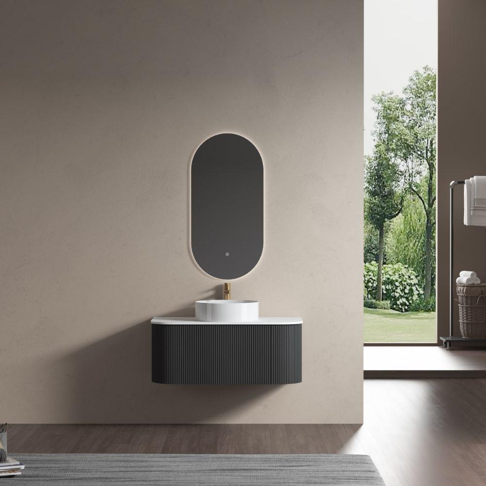 untitled-design_1359656607_xl Modern bathroom with a wall-mounted sink, oval mirror, and view of a garden through a large window. Minimalist design with natural light. | Sky Rye Design Modern bathroom with a wall-mounted sink, oval mirror, and view of a garden through a large window. Minimalist design with natural light.