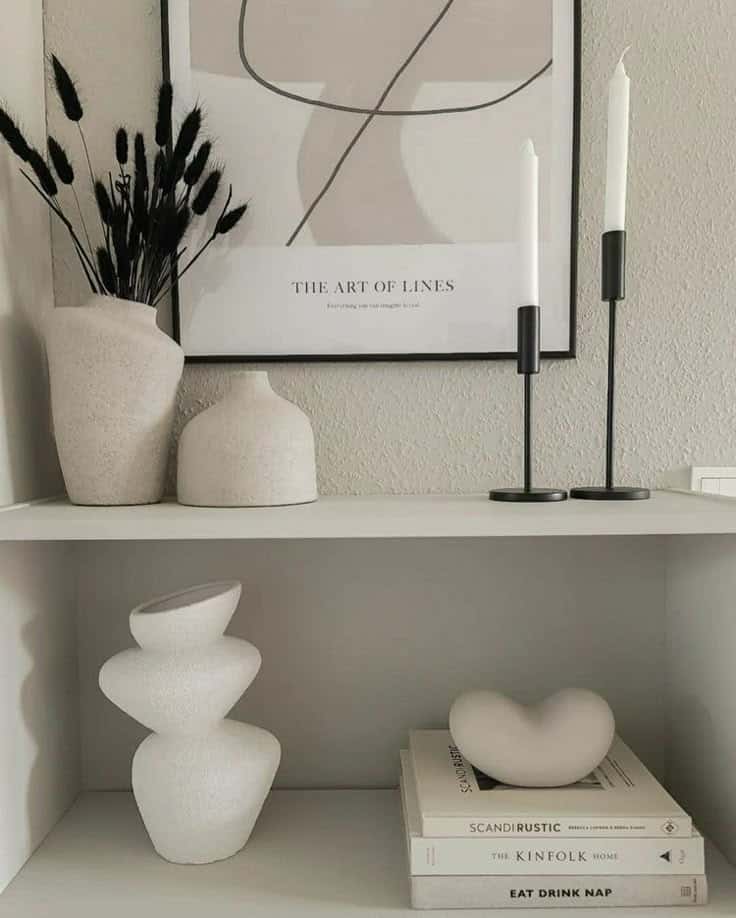 🤍 Minimalist shelf decor with abstract art, modern vases, candle holders, and design books. Neutral tones and clean lines create elegance. | Sky Rye Design Minimalist shelf decor with abstract art, modern vases, candle holders, and design books. Neutral tones and clean lines create elegance.