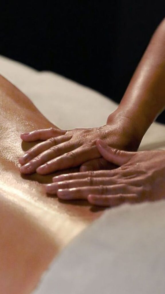 1 Instagram Massage therapist performing relaxing back massage therapy, hands applying oil for wellness and stress relief. | Sky Rye Design Massage therapist performing relaxing back massage therapy, hands applying oil for wellness and stress relief.