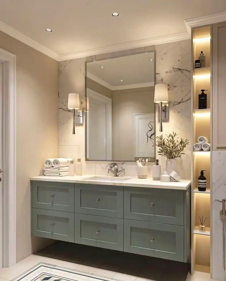 Modern bathroom with elegant vanity, large mirror, marble accents, and soft lighting. Decor includes rolled towels and