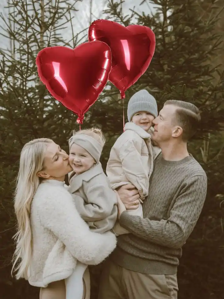 _ 12 Family enjoying a day outdoors, with red heart balloons, surrounded by trees, capturing love and joy in a serene natural setting. | Sky Rye Design Family enjoying a day outdoors, with red heart balloons, surrounded by trees, capturing love and joy in a serene natural setting.