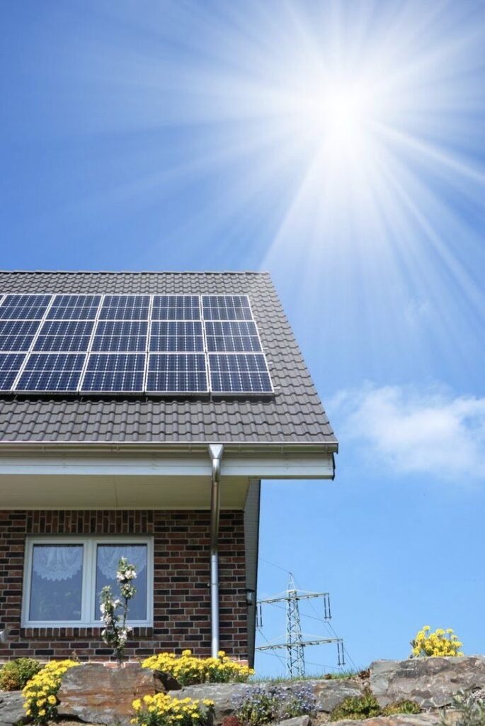 _ 14 Sunny day on an eco-friendly house with solar panels on the roof, showcasing renewable energy and blue sky. | Sky Rye Design Sunny day on an eco-friendly house with solar panels on the roof, showcasing renewable energy and blue sky.