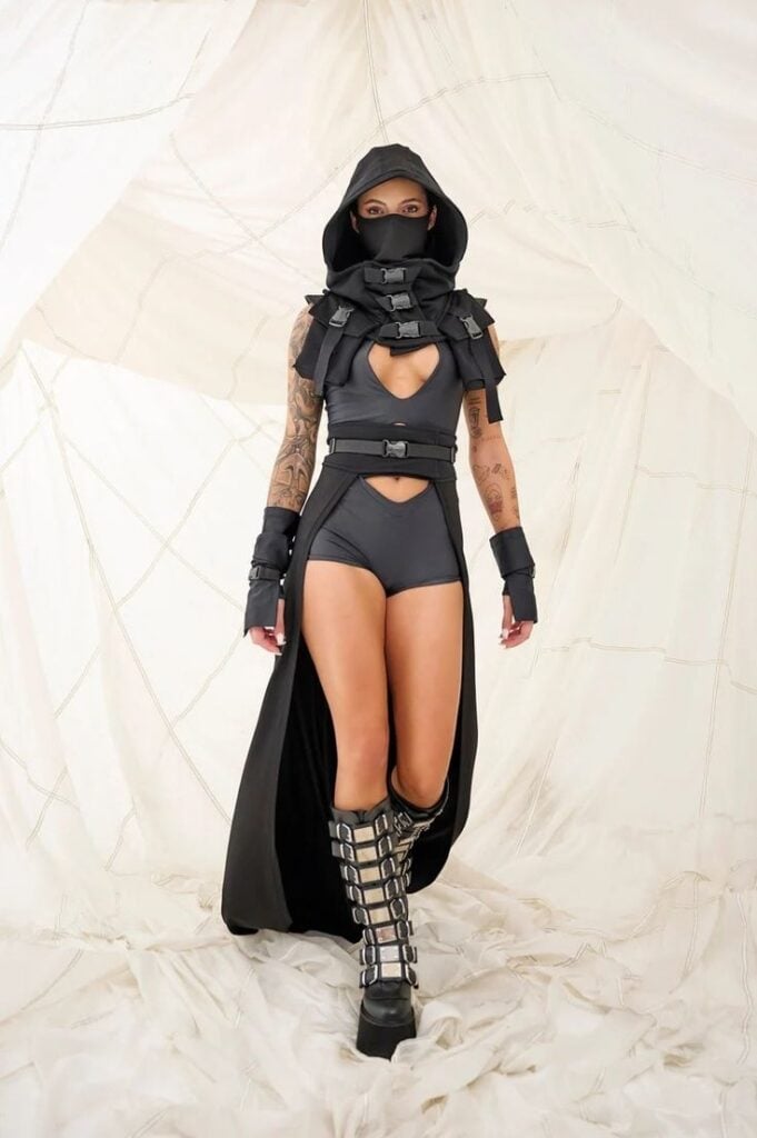 _ 16 Dystopian costume with hooded cloak, leather straps, and metallic boots, perfect for futuristic or post-apocalyptic fashion | Sky Rye Design Dystopian costume with hooded cloak, leather straps, and metallic boots, perfect for futuristic or post-apocalyptic fashion