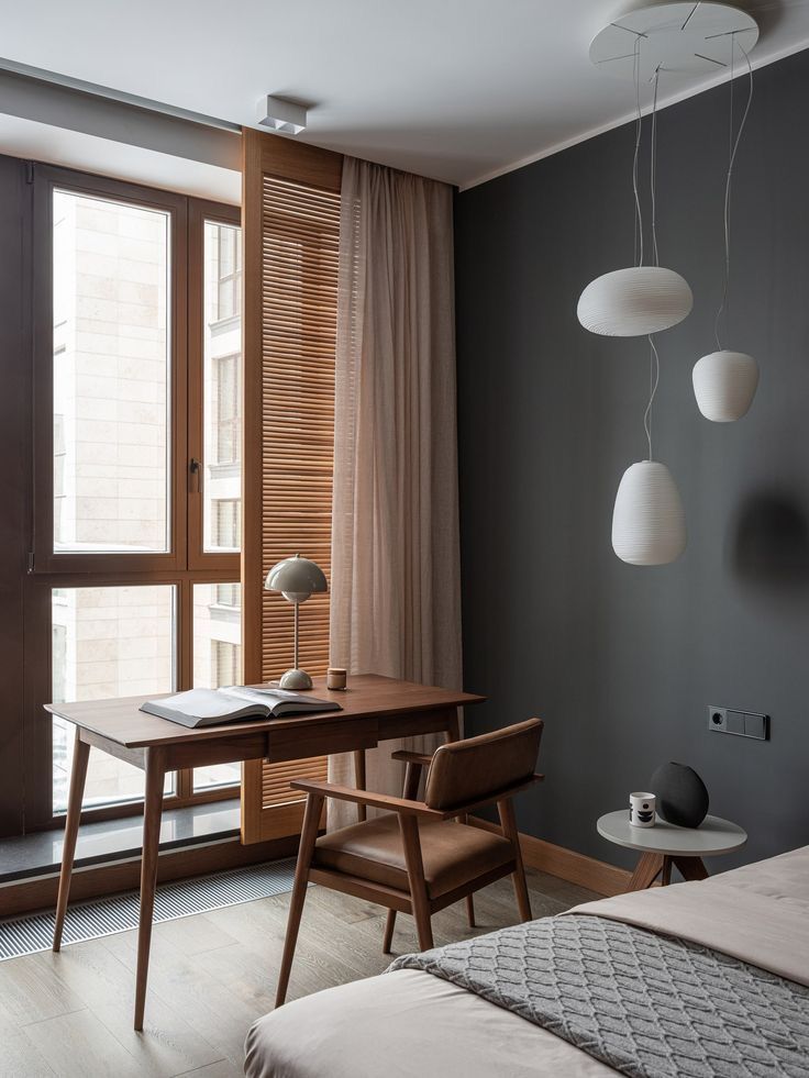 _ 20 Modern bedroom with wooden desk, chair, and pendant lights. Large window with shutters and curtains, showcasing minimalistic interior design. | Sky Rye Design Modern bedroom with wooden desk, chair, and pendant lights. Large window with shutters and curtains, showcasing minimalistic interior design.