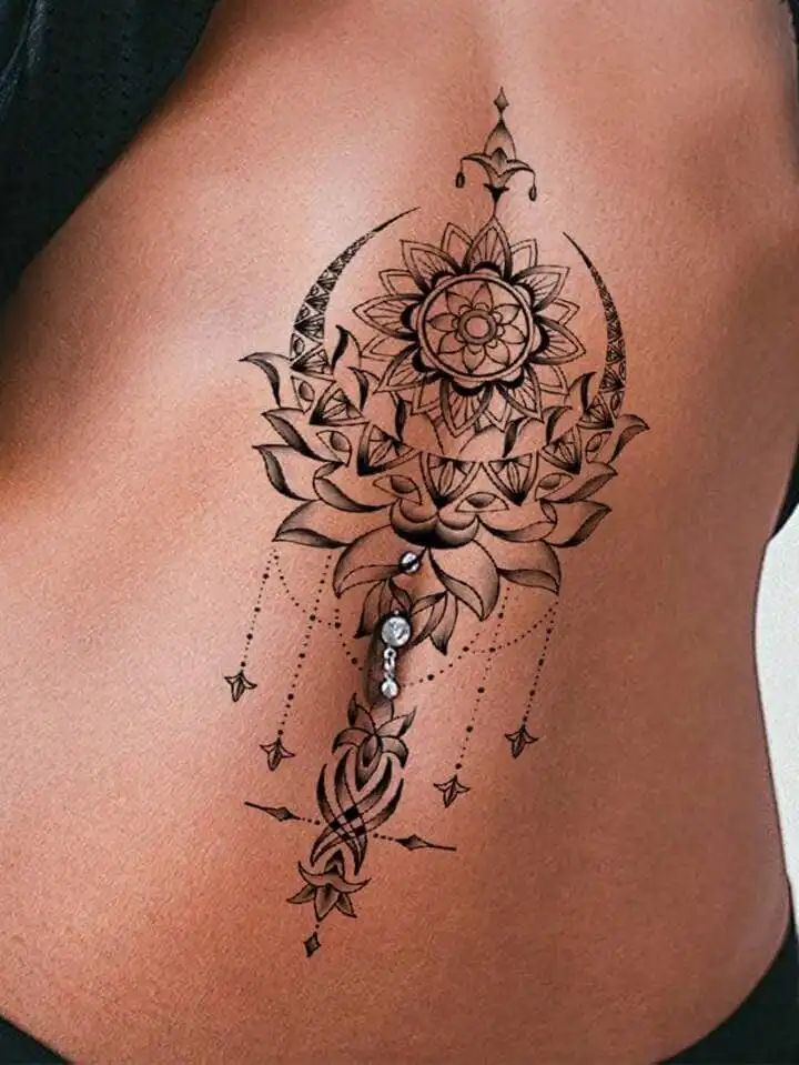 _ - 2026-01-04T190543062 Intricate mandala belly tattoo with floral and crescent moon design on skin, adorned with a shiny belly button piercing. | Sky Rye Design Intricate mandala belly tattoo with floral and crescent moon design on skin, adorned with a shiny belly button piercing.