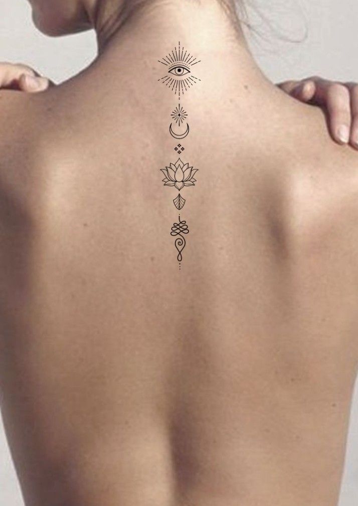 _ - 2026-01-10T233034450 Minimalist spine tattoo with an eye, moon, lotus, and geometric shapes on a woman's back, symbolizing spirituality and balance. | Sky Rye Design Minimalist spine tattoo with an eye, moon, lotus, and geometric shapes on a woman's back, symbolizing spirituality and balance.