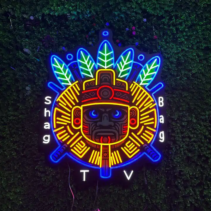 28_1 Vibrant neon Aztec mask against lush greenery, surrounded by the text Shag Bag TV in glowing letters. | Sky Rye Design Vibrant neon Aztec mask against lush greenery, surrounded by the text Shag Bag TV in glowing letters.