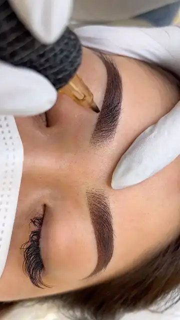 36a8c33e508dcc6871586a259ab4f60e Close-up of a woman receiving eyebrow tattooing. Aesthetician uses a precision tool for natural-looking, enhanced brows. Beauty treatment. | Sky Rye Design Close-up of a woman receiving eyebrow tattooing. Aesthetician uses a precision tool for natural-looking, enhanced brows. Beauty treatment.