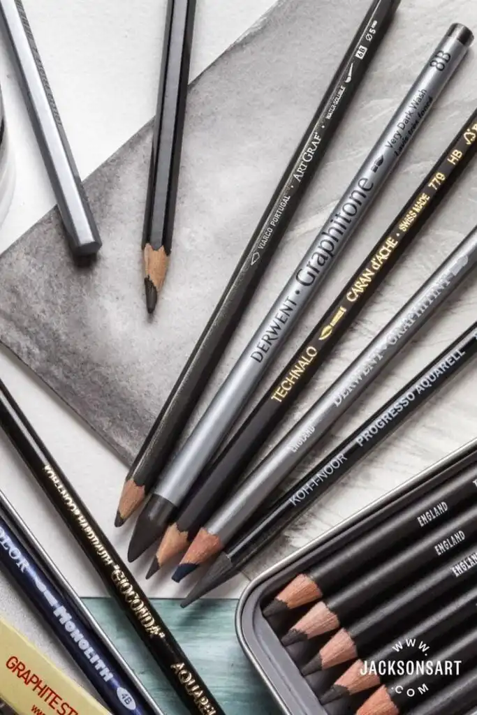 _ 48 Assorted graphite pencils for drawing and sketching spread out on paper, showcasing brands and shades. Ideal art tools for artists and designers. | Sky Rye Design Assorted graphite pencils for drawing and sketching spread out on paper, showcasing brands and shades. Ideal art tools for artists and designers.