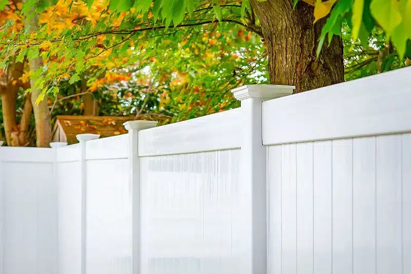 678ef54a9173fd1f536d9c6b_A close-up of a white vinyl privacy fence | Sky Rye Design