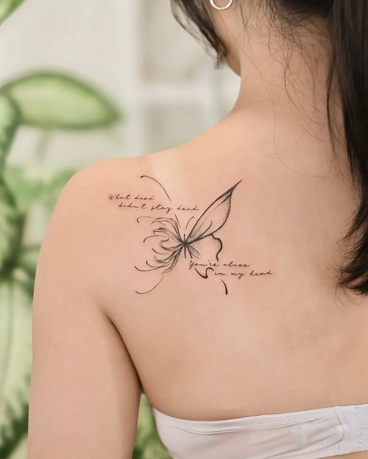 75+ Half Butterfly Half Flower Tattoos for Beauty and Transformation Delicate butterfly tattoo with handwritten quote on woman's shoulder, blending art and words in a minimalist design. | Sky Rye Design Delicate butterfly tattoo with handwritten quote on woman's shoulder, blending art and words in a minimalist design.