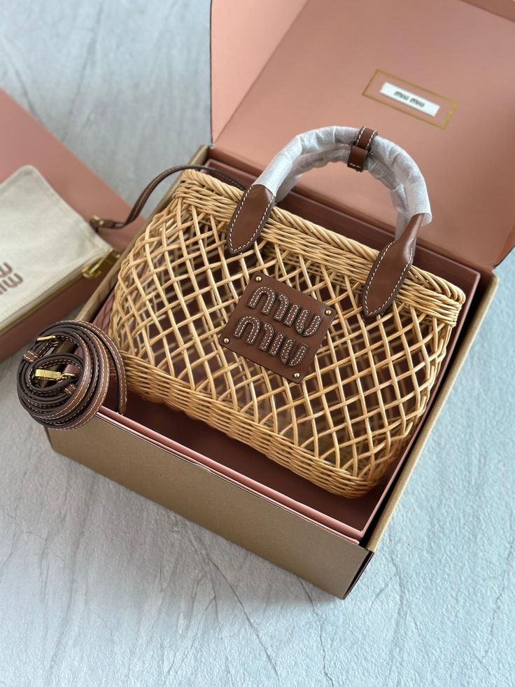 _ 75 Woven designer handbag with leather handles in a sleek box. Includes a matching pouch and belt. Perfect blend of style and elegance. | Sky Rye Design Woven designer handbag with leather handles in a sleek box. Includes a matching pouch and belt. Perfect blend of style and elegance.