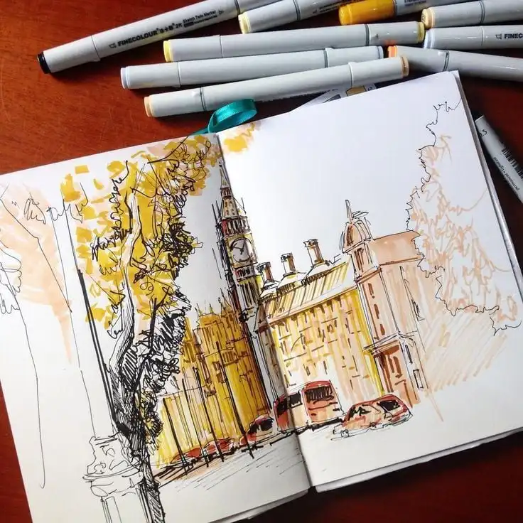 Sketch of Big Ben in an open notebook surrounded by markers, showcasing an artistic representation of London.