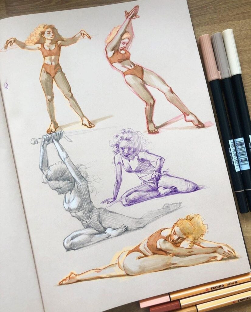 Sketchbook page of colorful female figure drawings and gesture studies in various yoga/dance poses, rendered with markers and pens.