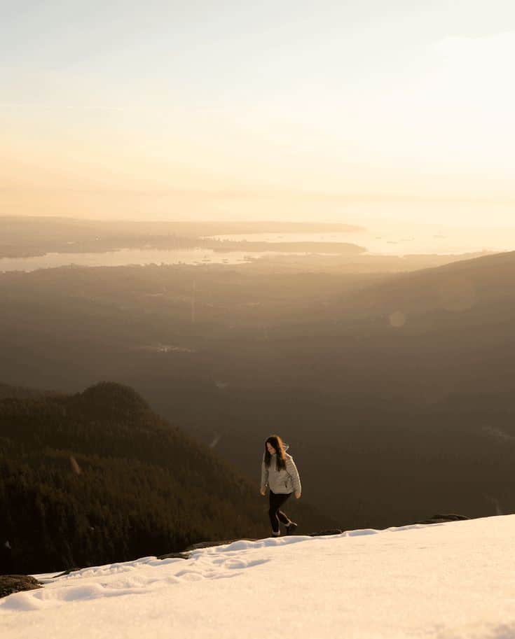 How To Use White Balance In Photography Brendan Williams Creative Person hiking in snowy mountains at sunrise, overlooking a vast forest and distant cityscape under a warm golden sky. | Sky Rye Design Person hiking in snowy mountains at sunrise, overlooking a vast forest and distant cityscape under a warm golden sky.