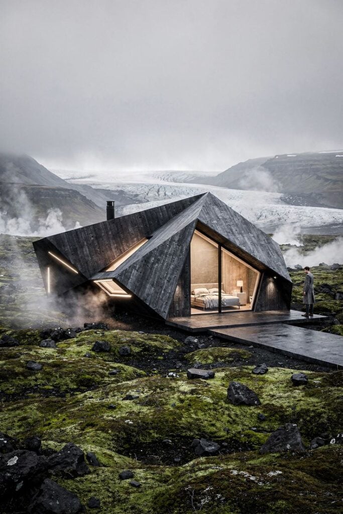Futuristic cabin with geometric design in misty, green landscape near mountains and glaciers, blending modern architecture with nature.