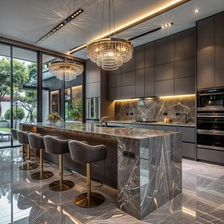 Luxury Kitchen Hanging Cabinet Furniture Modern Customized Modern Design Full Kitchen Cabinets Sets Luxury modern kitchen with marble island, sleek cabinetry, chandeliers, and floor-to-ceiling windows overlooking a garden patio. | Sky Rye Design Luxury modern kitchen with marble island, sleek cabinetry, chandeliers, and floor-to-ceiling windows overlooking a garden patio.