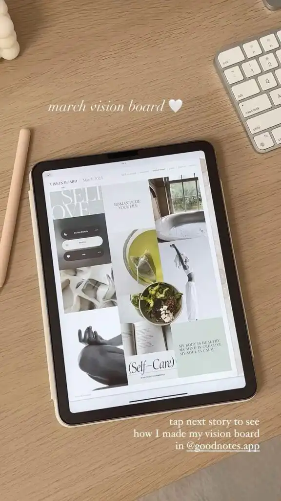 Make Digital Vision Board on iPad in Goodnotes app Digital Planner Digital Planning iPad Plann_ Tablet displaying a digital March vision board with self-care themes on a wooden desk beside a keyboard and stylus. | Sky Rye Design Tablet displaying a digital March vision board with self-care themes on a wooden desk beside a keyboard and stylus.