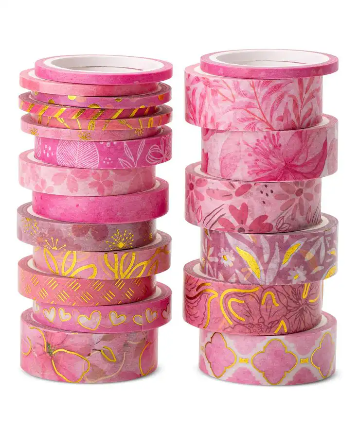 Stacks of pink decorative washi tapes with floral and geometric patterns, perfect for crafts and DIY projects.