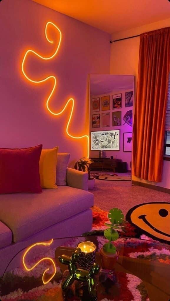 Vibrant living room with neon swirl lights, colorful pillows, retro art, and a cozy, eclectic vibe.