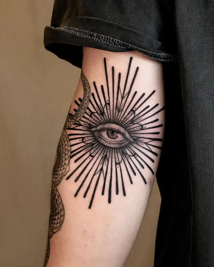 Open your Third eye 👁️ Look around new world Arm tattoo featuring an eye with radiant lines in black ink. Artistic design symbolizes watchfulness and spiritual insight. | Sky Rye Design Arm tattoo featuring an eye with radiant lines in black ink. Artistic design symbolizes watchfulness and spiritual insight.