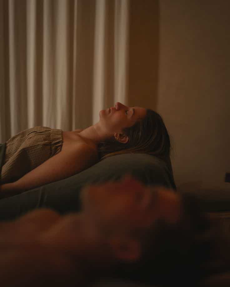 Surrender to serenity and let the gentle hands of our therapists relax you ✨ A serene setting with a person relaxing on a massage table, creating a peaceful ambiance perfect for spa relaxation and wellness. | Sky Rye Design A serene setting with a person relaxing on a massage table, creating a peaceful ambiance perfect for spa relaxation and wellness.