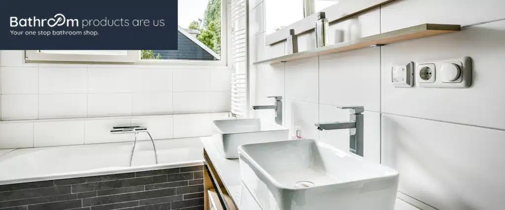 Modern bathroom with dual sinks, sleek faucets, and a bathtub, showcased by Bathroom Products Are Us store for stylish