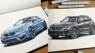 Illustrated sketches of a blue sports car and a black SUV on a sketchbook, surrounded by markers on a wooden desk.
