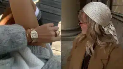 Elegant woman in chic outfit, wearing a gold watch and ring, with stylish headscarf and sunglasses, epitomizing modern fashion.