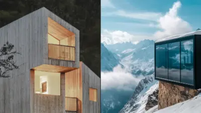 Modern wooden house and glass cabin overlooking stunning snow-capped mountain range on a sunny day.