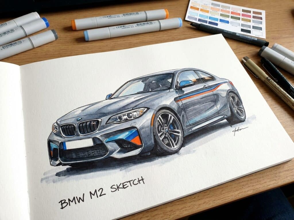 Hand-drawn BMW M2 sketch with markers on paper, surrounded by drawing tools, showcasing detailed design and vibrant colors.