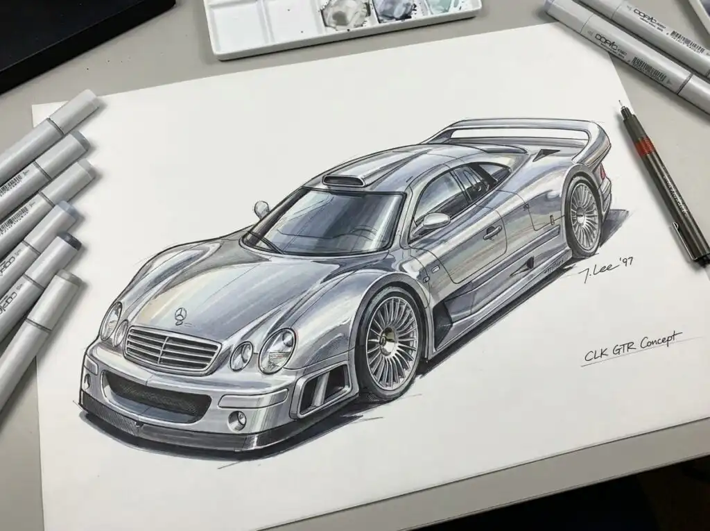 Illustration of a sleek silver sports car concept design with markers and pens on a desk, showcasing automotive artistry and