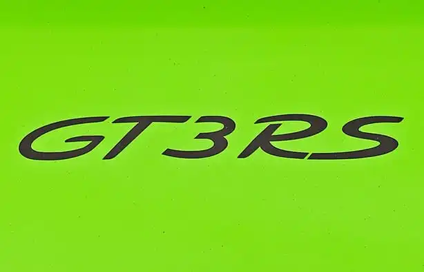 Bold black GT3 RS lettering on a vibrant green background, representing the high-performance sports car model.