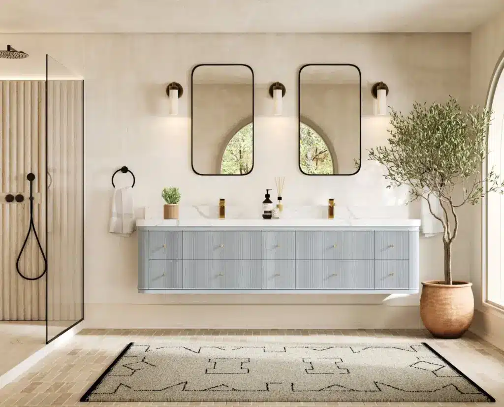 Modern bathroom with double sink vanity, wall mirrors, potted plant, shower, and natural light through arched window.