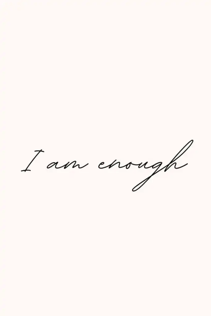 Inspirational minimalist text with I am enough in elegant script on a soft beige background, promoting positivity and self-worth.