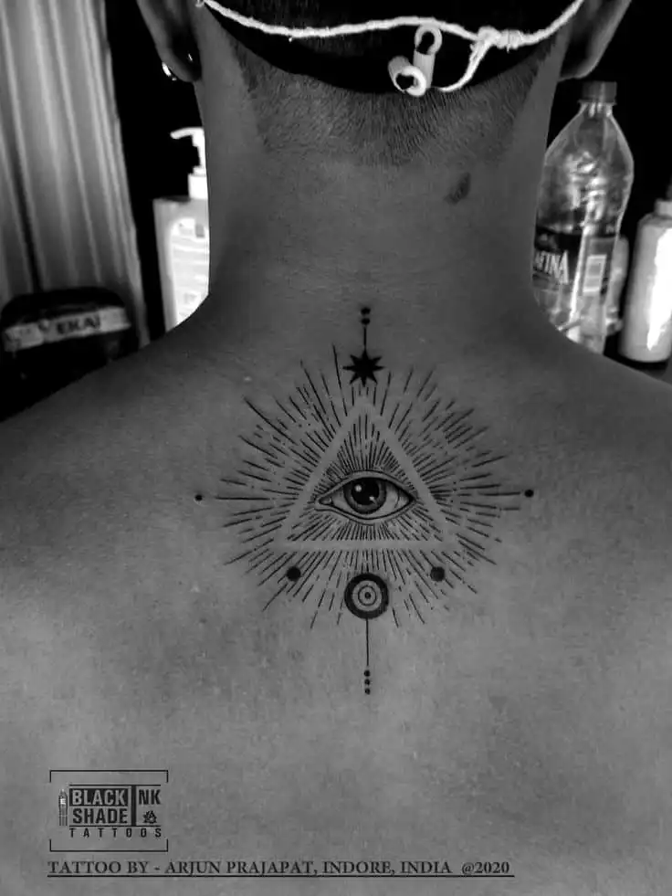 illuminati tattoo Back tattoo of an eye within a triangle, surrounded by intricate linework, created by Arjun Prajapat at Black Shade Tattoos, 2020. | Sky Rye Design Back tattoo of an eye within a triangle, surrounded by intricate linework, created by Arjun Prajapat at Black Shade Tattoos, 2020.