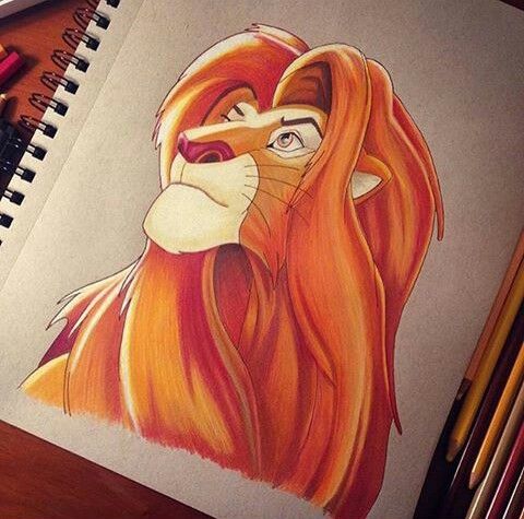 Illustration of a majestic lion with a flowing mane drawn in colorful pencils on sketchbook paper.